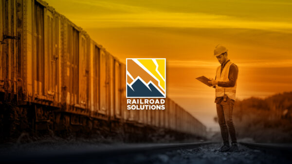Railroad Solutions Brand train on tracks logo